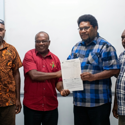 kandrian invests in Cocoa cheque present my Hon Joseph Lelang