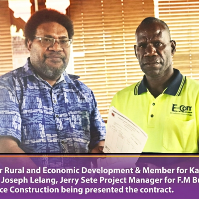 minister presents 3milion cheque for classrooms to FM Project manager